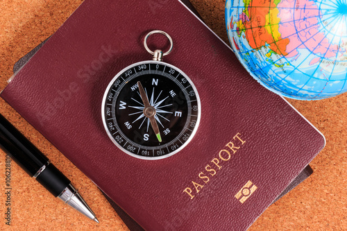 Preparation for travel, compass, passport, pen and inflatable wo photo