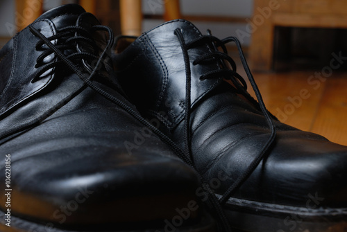 Black shoes lacing. Close-up.