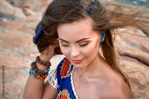 Fotografie Beautiful girl, bright clothes, accessories, relax mood, summer stone beach