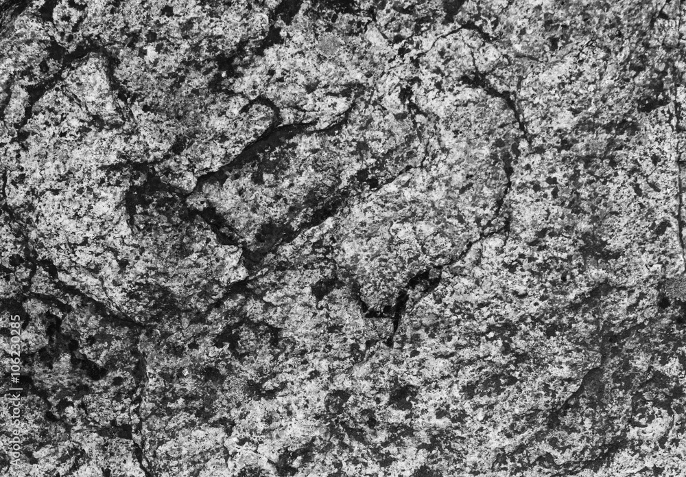 Contrast black and white texture of granite stone. Horizontal shot, monochrome, texture.
