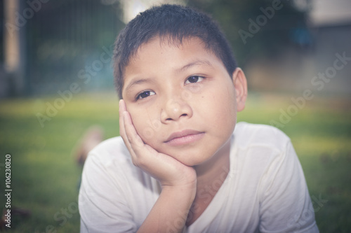 scared and alone  young Asian child who is at high risk of being bullied  trafficked and abused