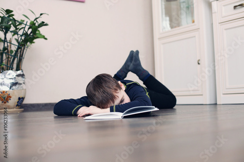 child was tired to read the book © monoliza