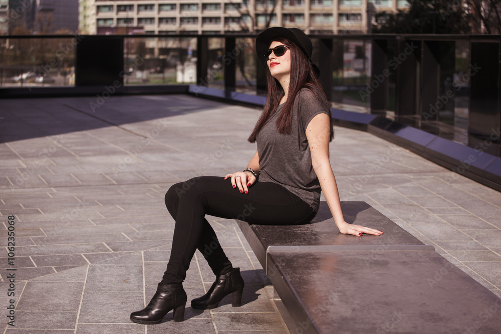 Young beautiful woman relaxing in the city Young beautiful woman relaxing in the city