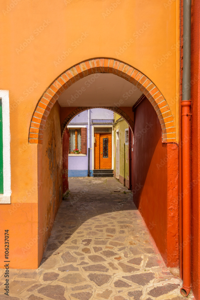 Fototapeta premium Entrance of a colorful apartment building in Burano, Venice, Italy.