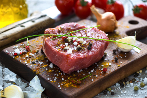 Fotografia Fresh raw beef steak on wooden background