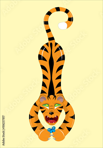 The tiger catches a blue butterfly paws