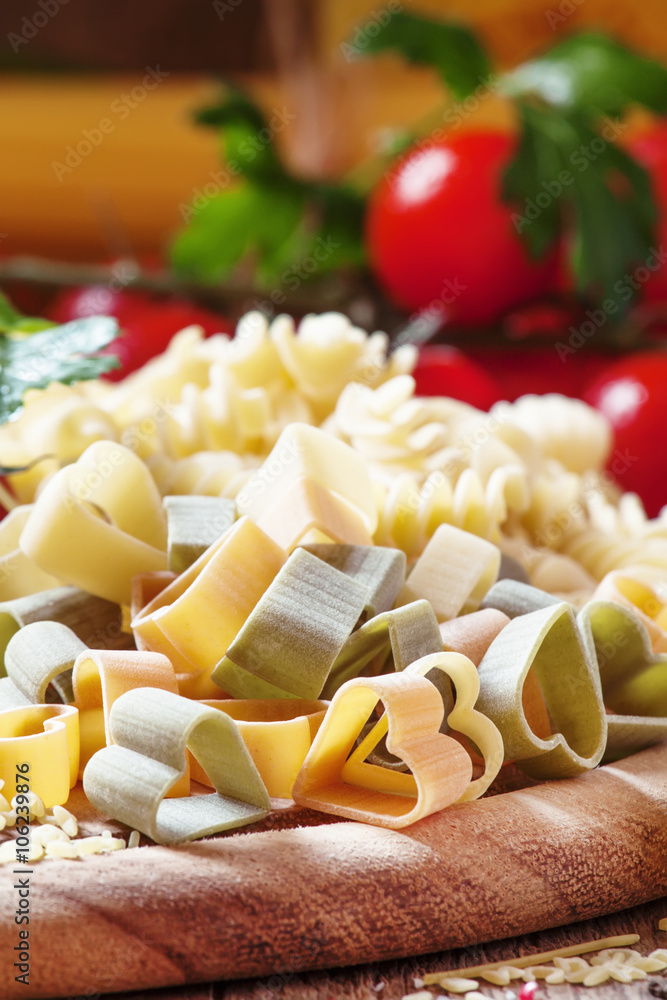 Dry pasta, three-colored hearts, vegetables and seasoning, selec