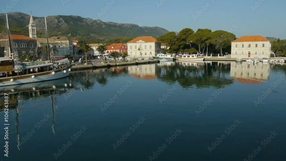 Aerial perspective, over anchored old wooden sailboat at Jelsa marine with beautiful background hills in the morning of Island Hvar.
Aerial perspective, over anchored old wooden sailboat at Jelsa marine with beautiful background hills in the morning of Island Hvar.