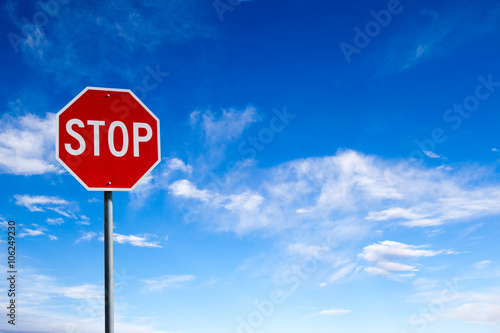 Stop Sign With Blue Sky Background and Copy Space