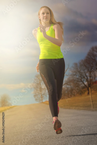 Fit young blonde woman runn...
