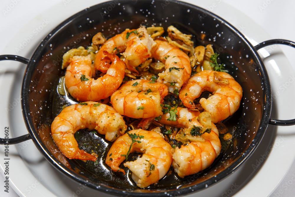 delicious prepared shrimps in the fry pan delicious prepared shrimps in the fry pan