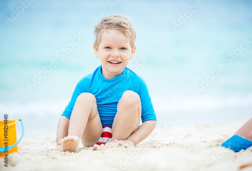 Cute little boy playing on the beach