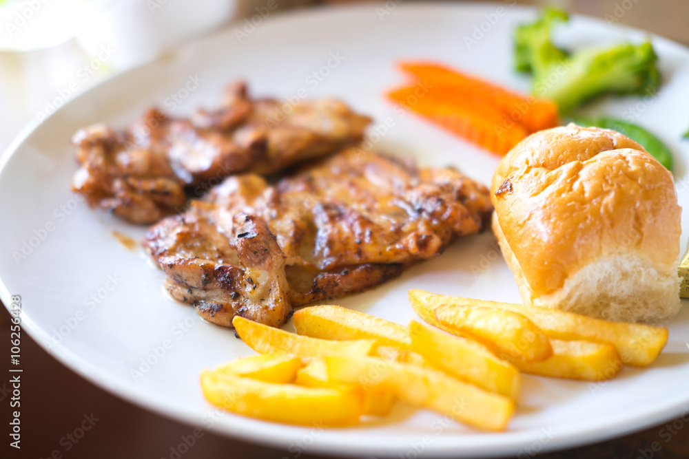 grilled pork chop (neck cut) with bread and french fries