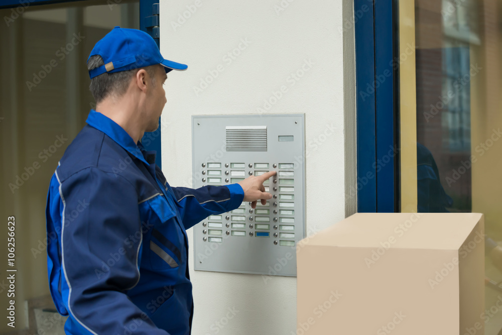 Delivery Man With Trolley Using Security To Enter Building Delivery Man With Trolley Using Security To Enter Building