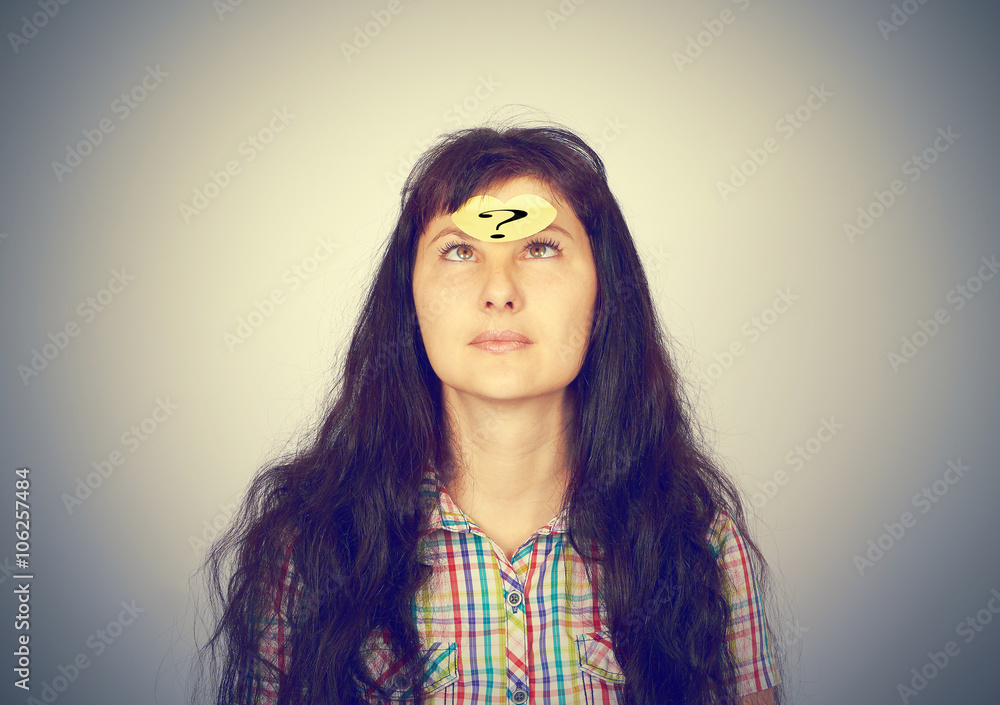 girl with a question mark over her forehead girl with a question mark over her forehead