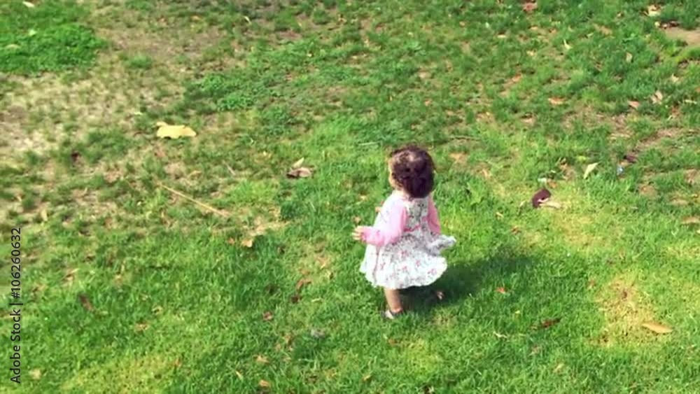 Little girl run on green grass. Children childhood conceptThis video is about Ozen haman Little girl run on green grass. Children childhood conceptThis video is about Ozen haman