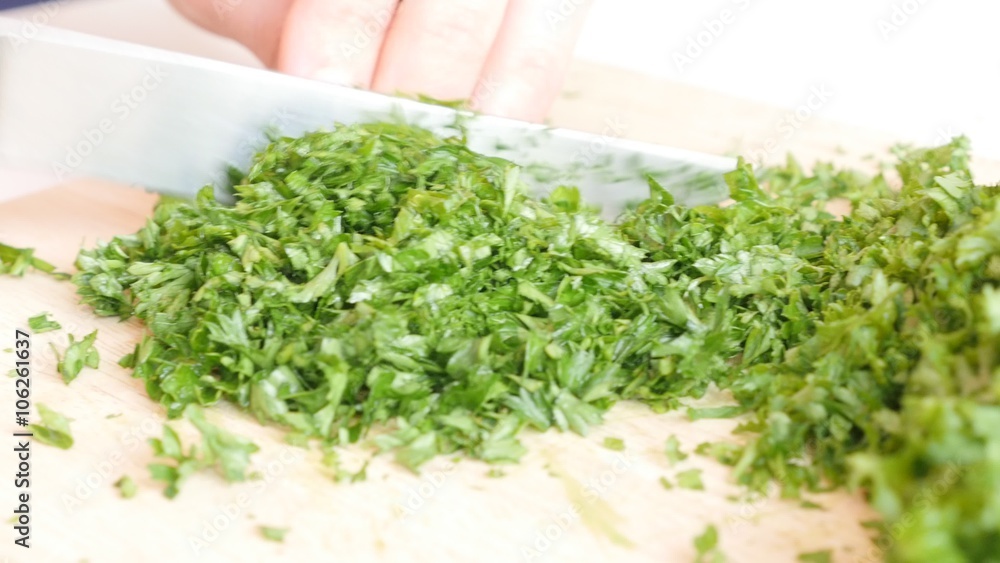 Cutting parsley plant on smaller pieces 4K 3840X2160 UltraHD footage - Petroselinum crispum plant cut on cutting board 4K 2160p UHD video Cutting parsley plant on smaller pieces 4K 3840X2160 UltraHD footage - Petroselinum crispum plant cut on cutting board 4K 2160p UHD video