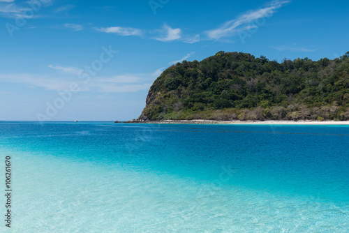 Beach on the tropical island with green water © sorapop