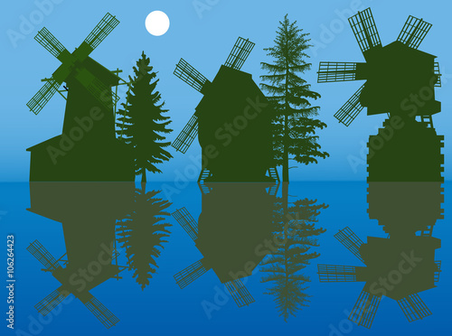 three obsolete windmills silhouettes on blue