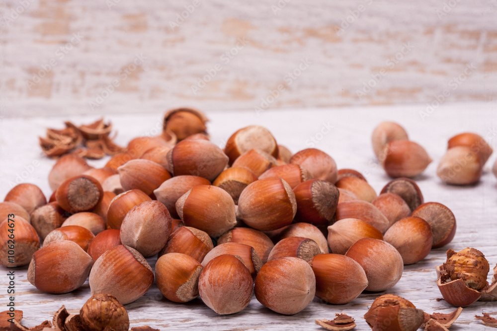 Nuts on white wooden background in studio photo Nuts on white wooden background in studio photo