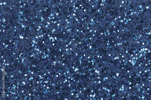 Texture from blue glitter. Low contrast photo.
