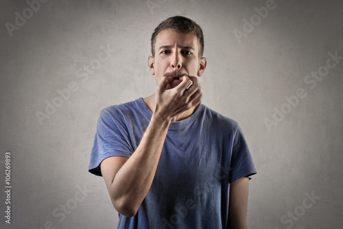 Man trying to whistle photo