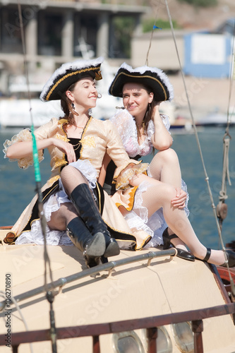 Two girls in pirate costumes outdoors © azazello