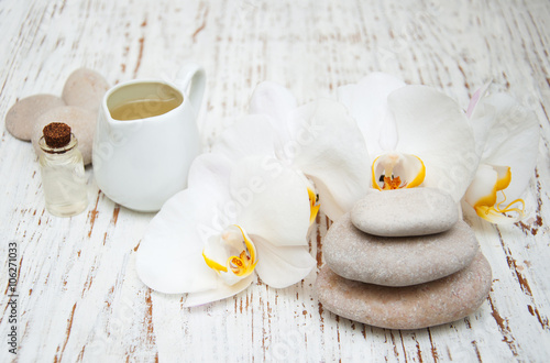 White orchids with massage stones