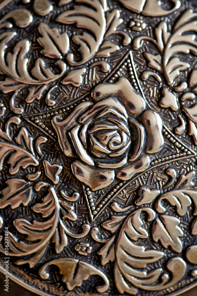 detail shot of carved metal design for background texture