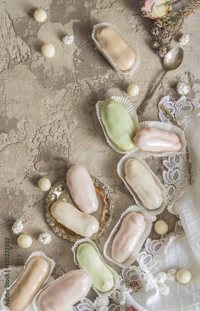 Eclairs pastel colors - French dessert in a vintage background