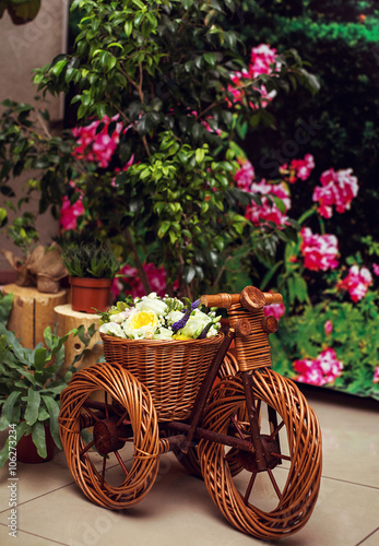 Wooden bicycle toy for decorative with live  flowers. wedding de
