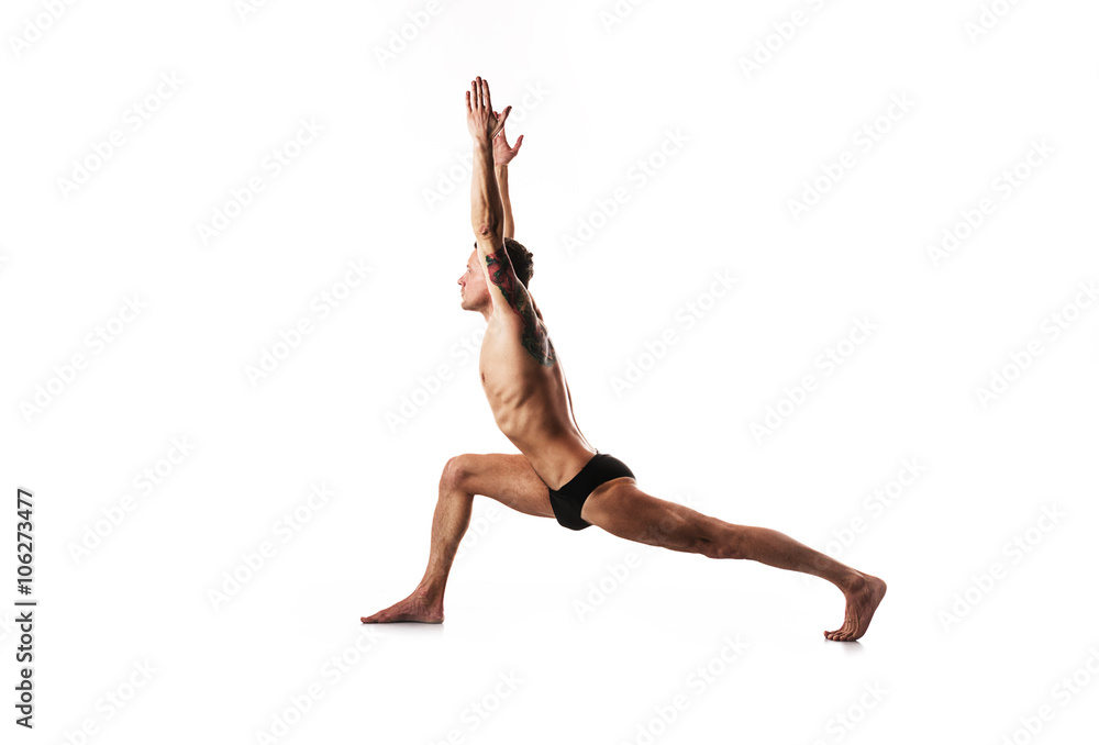 Fototapeta premium yoga and gymnastics, posture hero, lunge on the leg with his hands up