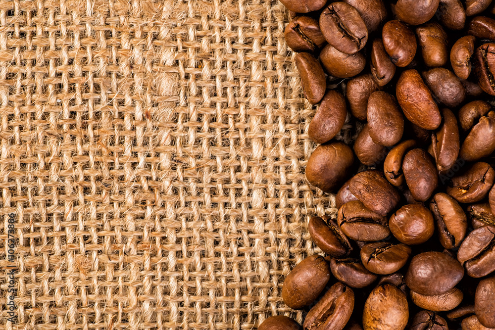 Closeup of two coffee beans at roasted coffee heap. Coffee bean Closeup of two coffee beans at roasted coffee heap. Coffee bean