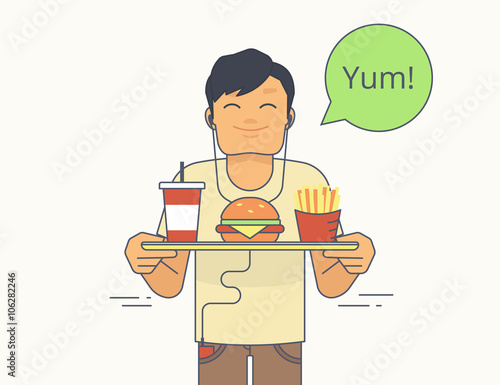 Happy guy holds a tray with big hamburger, french fries and milkshake and going to eat it. Isolated on white with green bubble and text yum