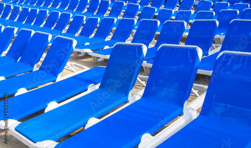 Many blue deck-chairs