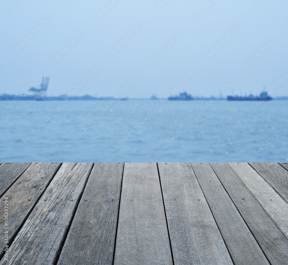 Empty old wood floor over blur of cargo ship with shipping port, Empty old wood floor over blur of cargo ship with shipping port,