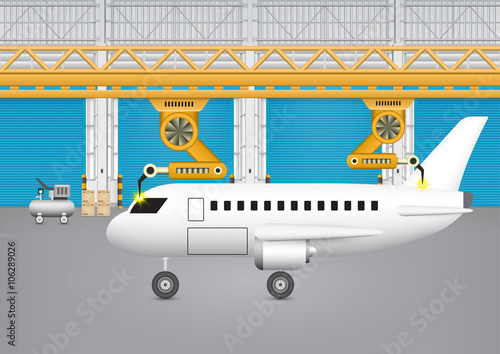 Robot working with plane in factory.