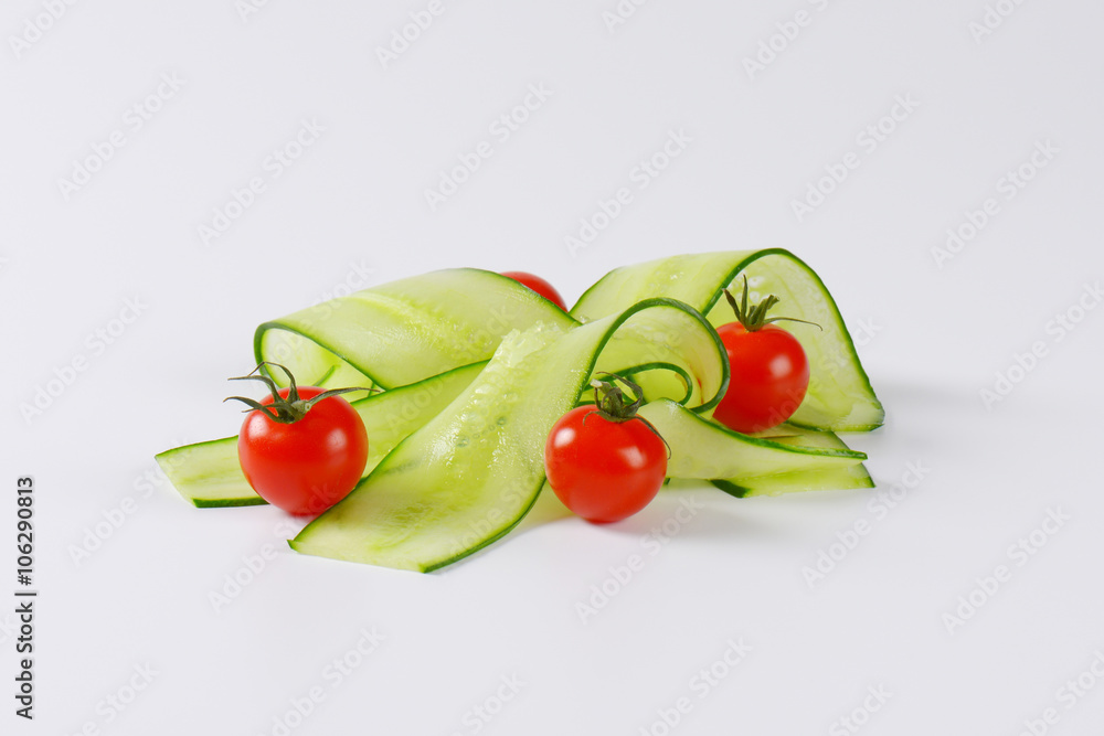 thin cucumber slices and cherry tomatoes thin cucumber slices and cherry tomatoes