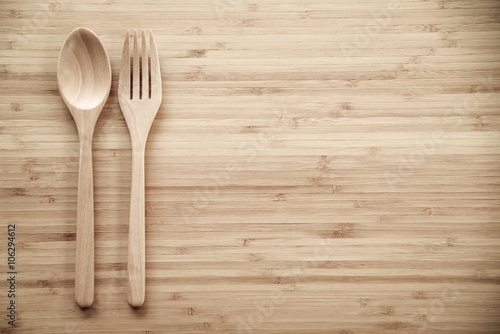 Wooden spoon and fork on table