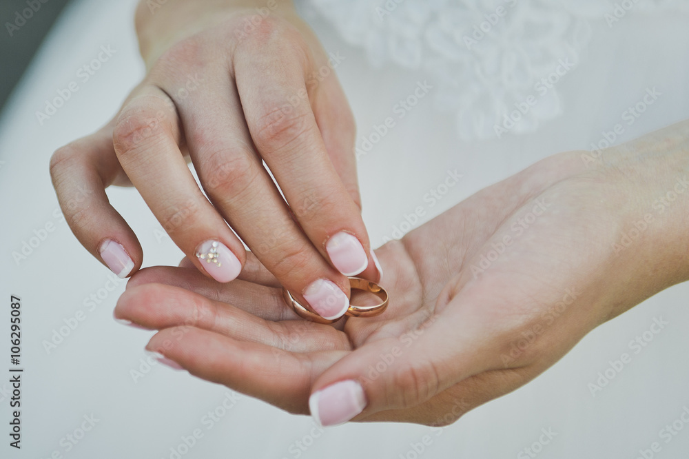 In your hands lie the newlyweds wedding ring 5734. In your hands lie the newlyweds wedding ring 5734.