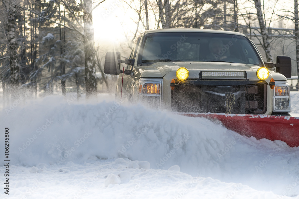 Snow plow doing snow removal after a blizzard Snow plow doing snow removal after a blizzard