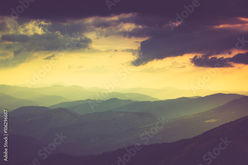 Landscape of misty mountain hills in spring.