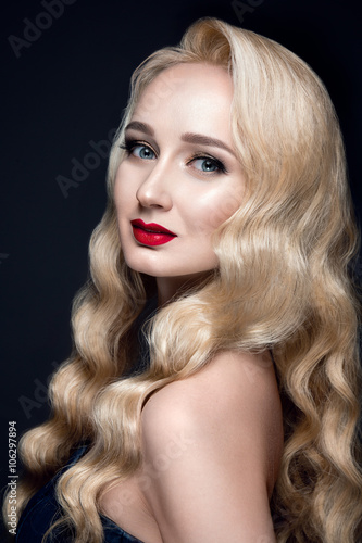 Beautiful woman portrait in retro style. Red lips. Blond hair. Beauty