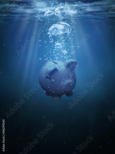 Crisis concept, drowning piggy bank with copy space