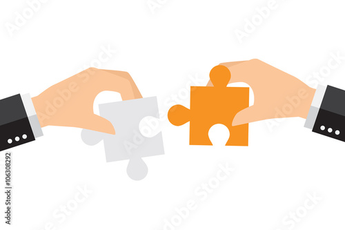 Business people solving oversized jigsaw puzzle together