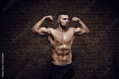Young muscular man posing