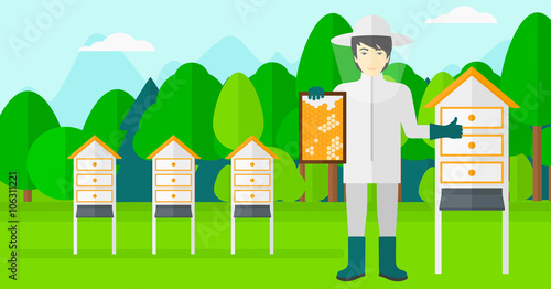 Bee-keeper at apiary.