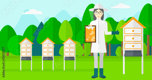 Bee-keeper at apiary.