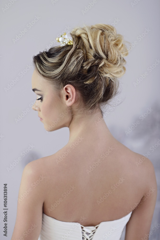 Beauty bride in bridal gown indoors. Beautiful model girl in a white wedding dress. Female portrait of cute lady. Woman with hairstyle Beauty bride in bridal gown indoors. Beautiful model girl in a white wedding dress. Female portrait of cute lady. Woman with hairstyle