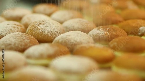 Bakehouse. Cream buns sprinkled with powdered sugar